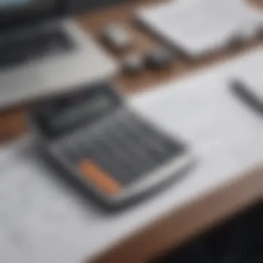 A calculator and financial documents on a desk