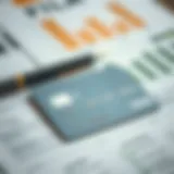 A close-up of a credit card with a blurred background of financial documents