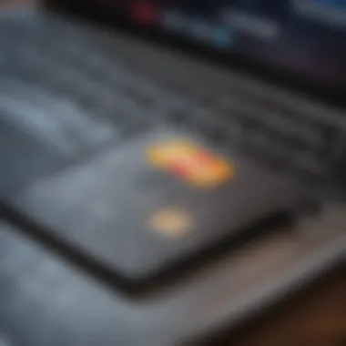 Secured Credit Card Essentials A close-up of a secured credit card with a laptop in the background